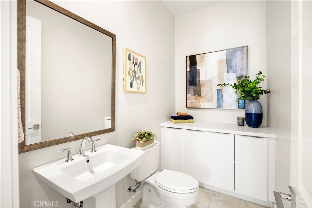 130 Pin Lane Lake Forest, CA 92630 - Photo 24 of 70 a bathroom with a sink a toilet and mirror