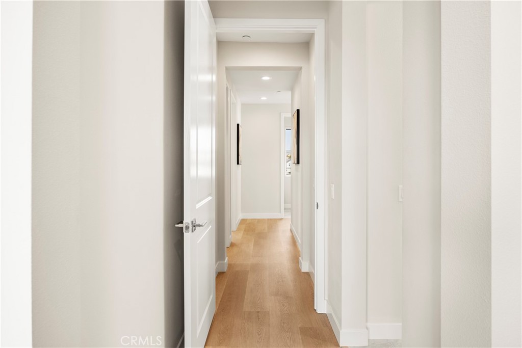 130 Pin Lane Lake Forest, CA 92630 - Photo 49 of 70 a view of a hallway with wooden floor