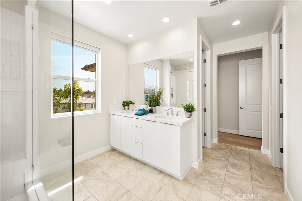 130 Pin Lane Lake Forest, CA 92630 - Photo 54 of 70 a bathroom with a granite countertop sink mirror and