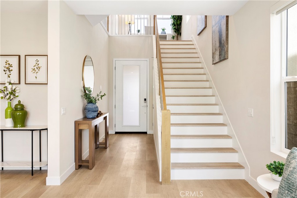 130 Pin Lane Lake Forest, CA 92630 - Photo 7 of 70 a view of a bedroom with wooden floor and stairs