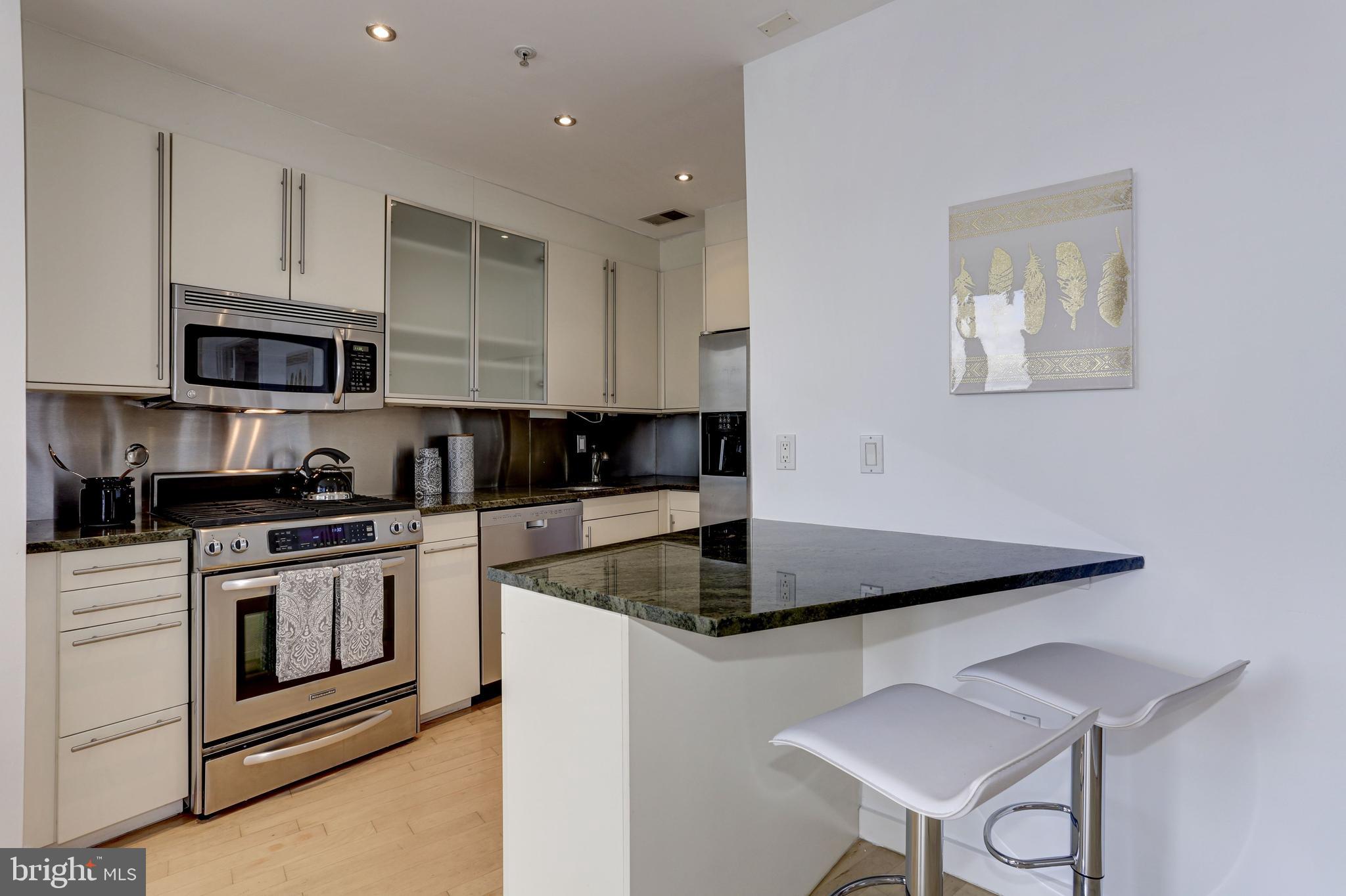 1300 13th Street Northwest, Unit 603 Washington, DC 20005 - Photo 6 of 18 Kitchen w/ Breakfast Bar