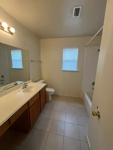 a bathroom with a sink a vanity and a mirror