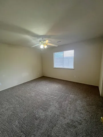 an empty room with a empty space and windows