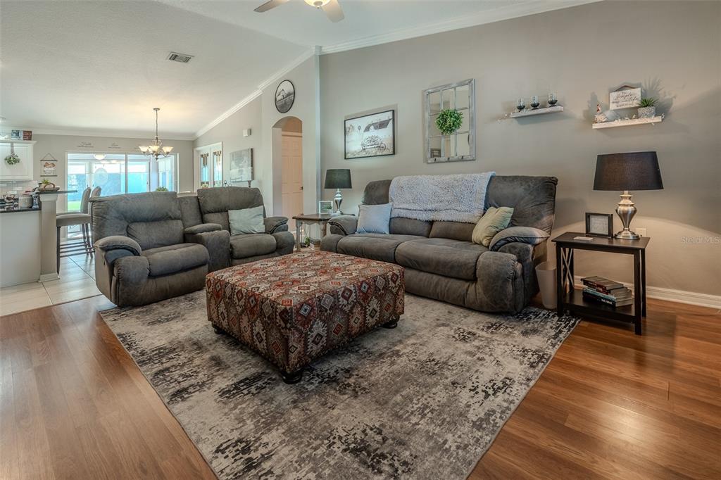 15143 Southwest 14th Avenue Road Ocala, FL 34473 - Photo 5 of 53 a living room with furniture and wooden floor