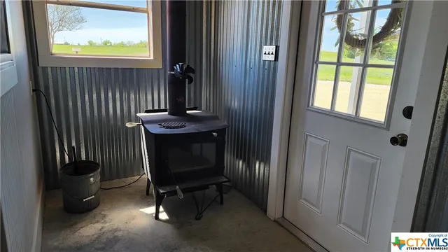 a view of a door and chair in a room