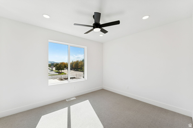 254 North Main Street Bountiful, UT 84010 - Photo 19 of 45 Spare room featuring carpet, recessed lighting, and a ceiling fan