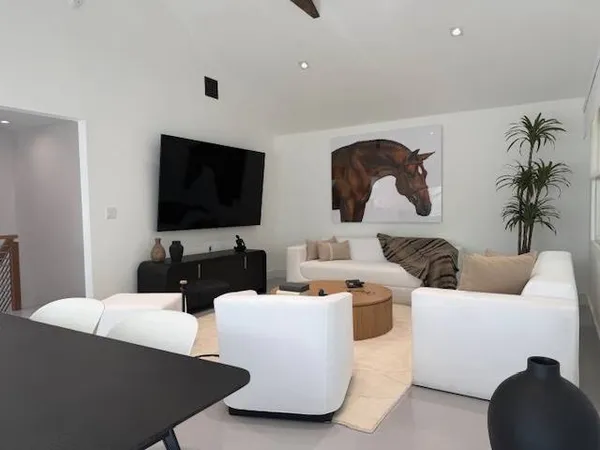 a living room with furniture and a flat screen tv