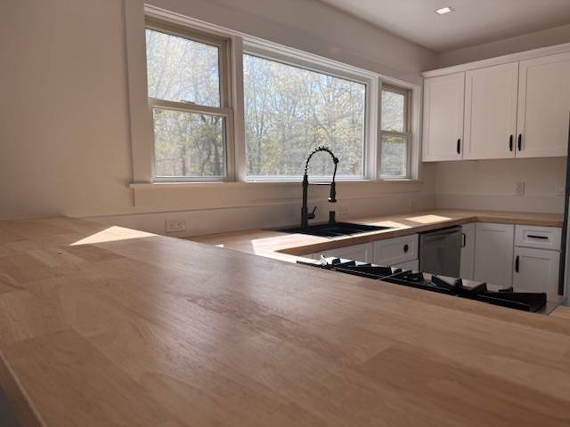 876 A Millstone Road Water Mill, NY 11976 - Photo 3 of 12 a kitchen with a sink a counter top space and cabinets
