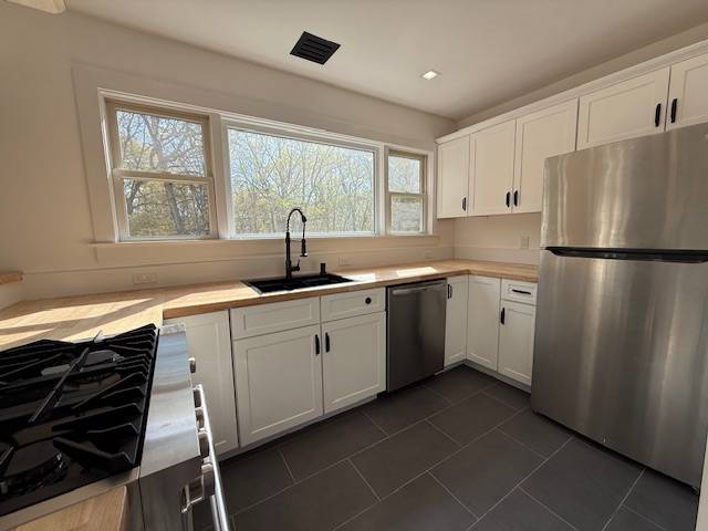 876 A Millstone Road Water Mill, NY 11976 - Photo 4 of 12 a kitchen with a sink a refrigerator and window