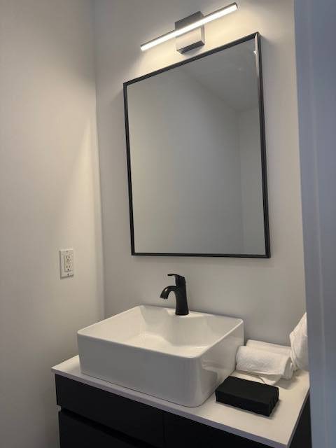 876 A Millstone Road Water Mill, NY 11976 - Photo 5 of 12 a bathroom with a sink and mirror