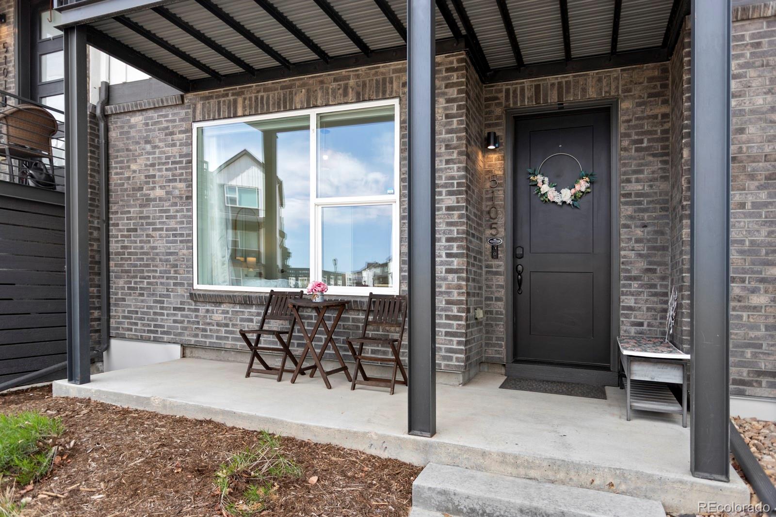 5105 Vivian Street Wheat Ridge, CO 80033 - Photo 2 of 39 a patio with table and chairs