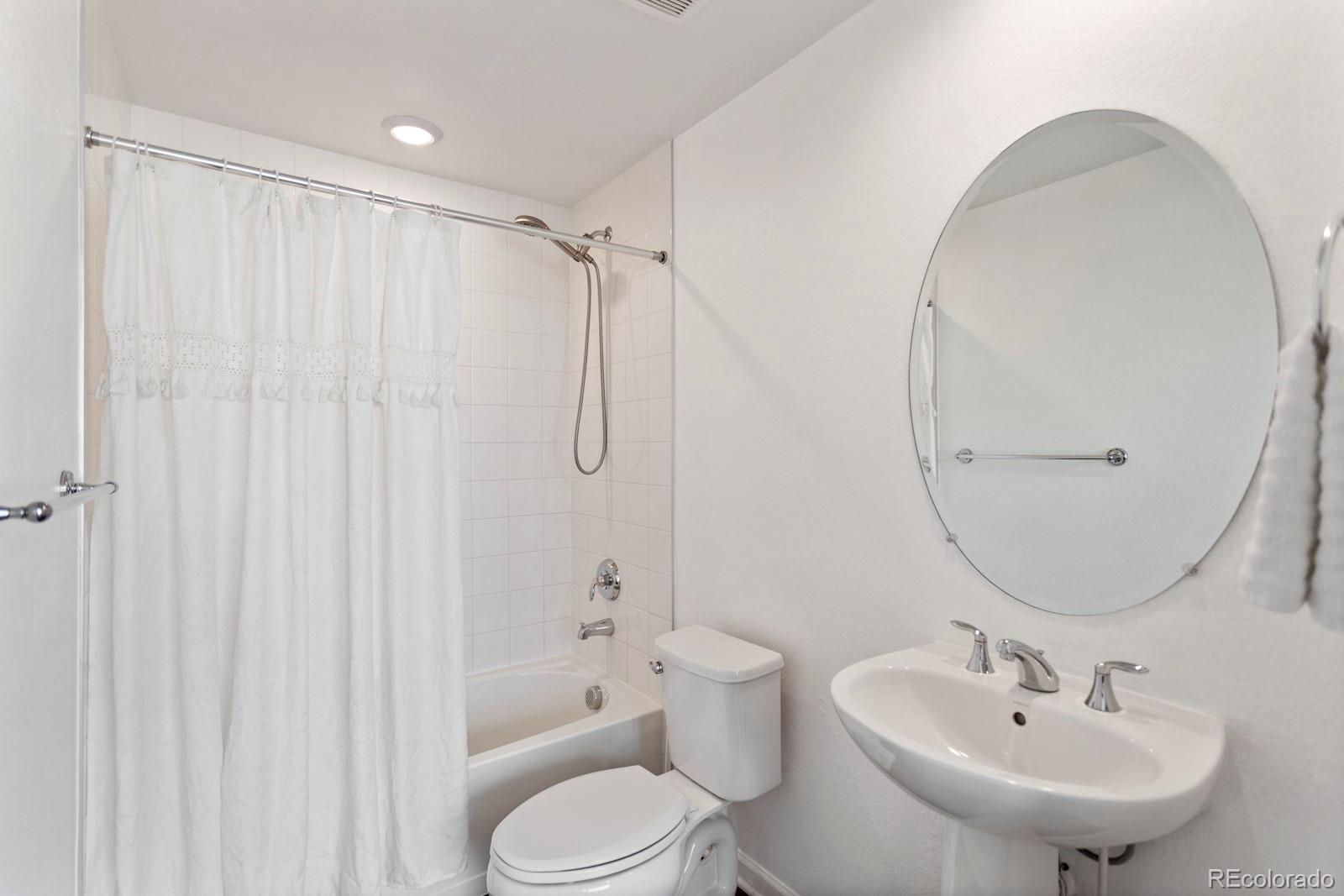5105 Vivian Street Wheat Ridge, CO 80033 - Photo 26 of 39 a bathroom with a sink toilet and shower