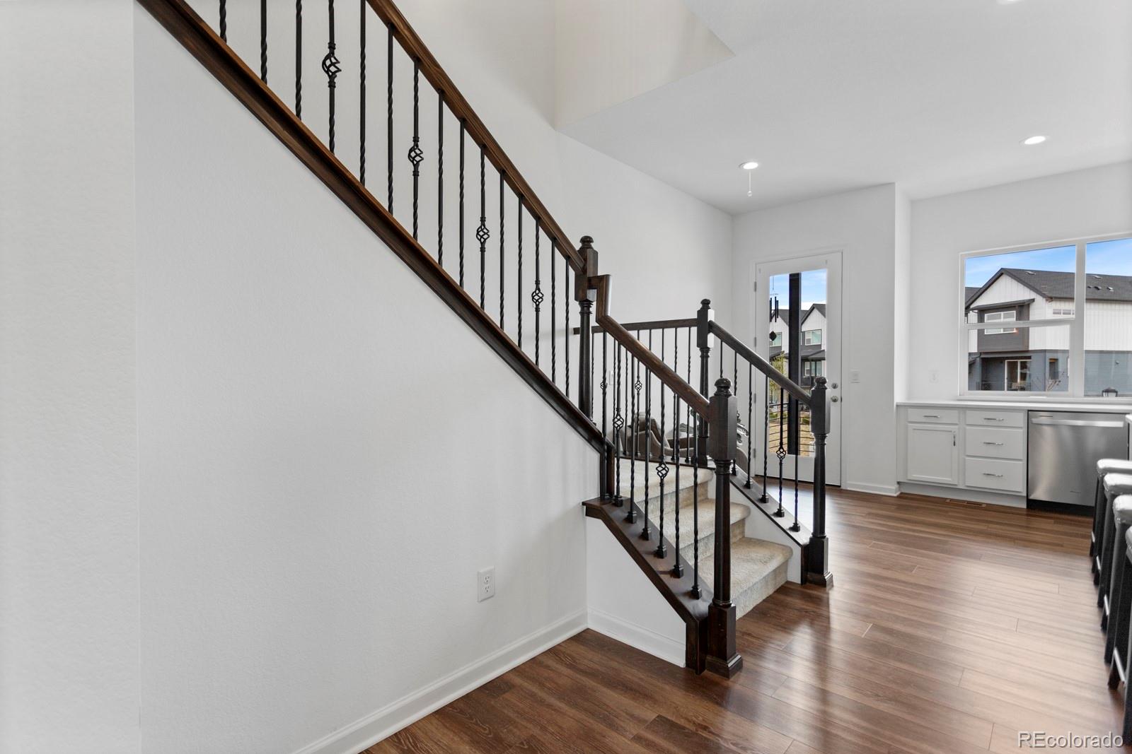 5105 Vivian Street Wheat Ridge, CO 80033 - Photo 10 of 39 a view of a hallway with wooden floor and entryway