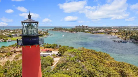 an aerial view of a house with a ocean view
