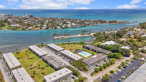 an aerial view of a city with ocean view