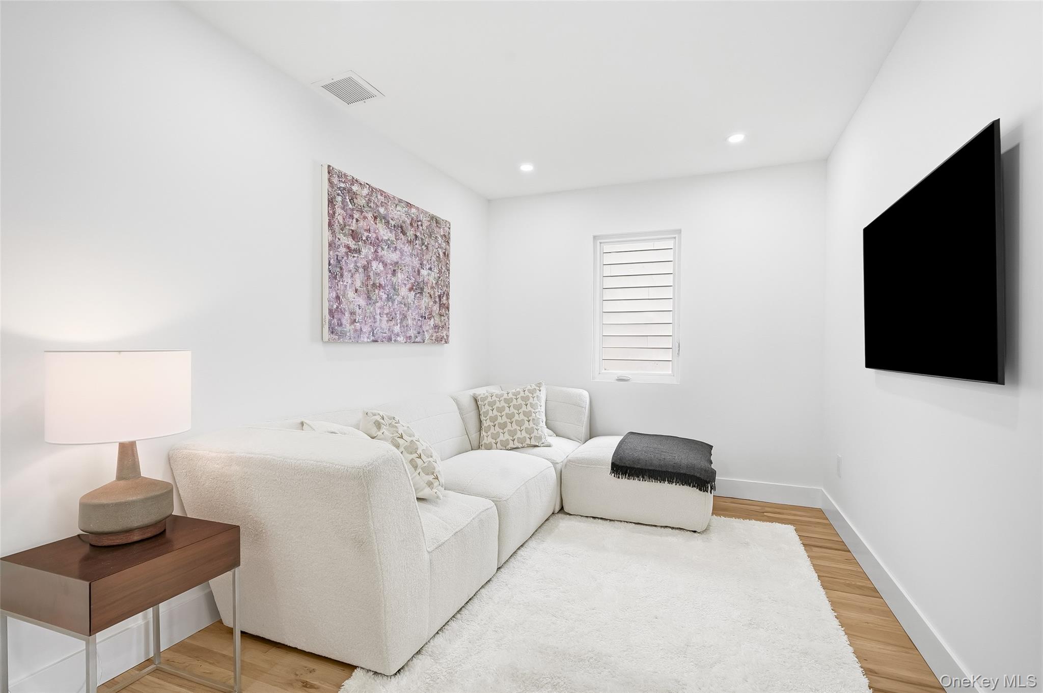 2222 Boston Post Road Larchmont, NY 10538 - Photo 20 of 40 Living room featuring light wood-type flooring and recessed lighting