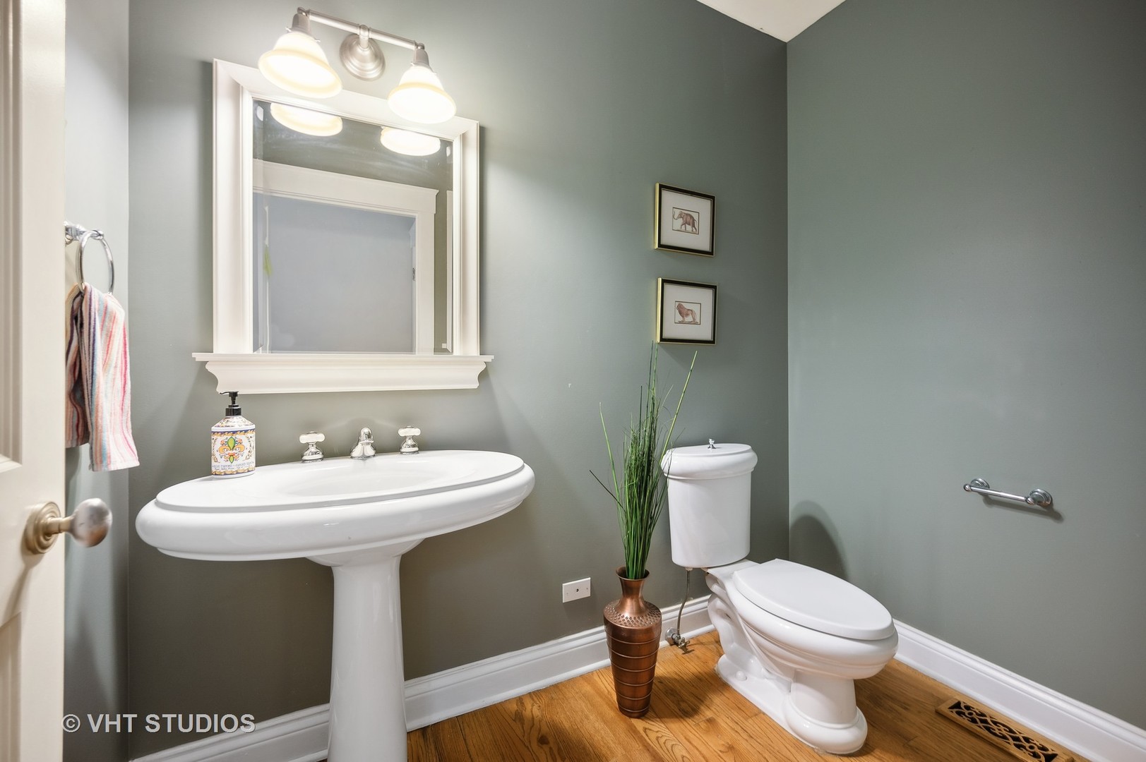 724 Juniper Road Glenview, IL 60025 - Photo 20 of 27 a bathroom with a sink toilet and a mirror