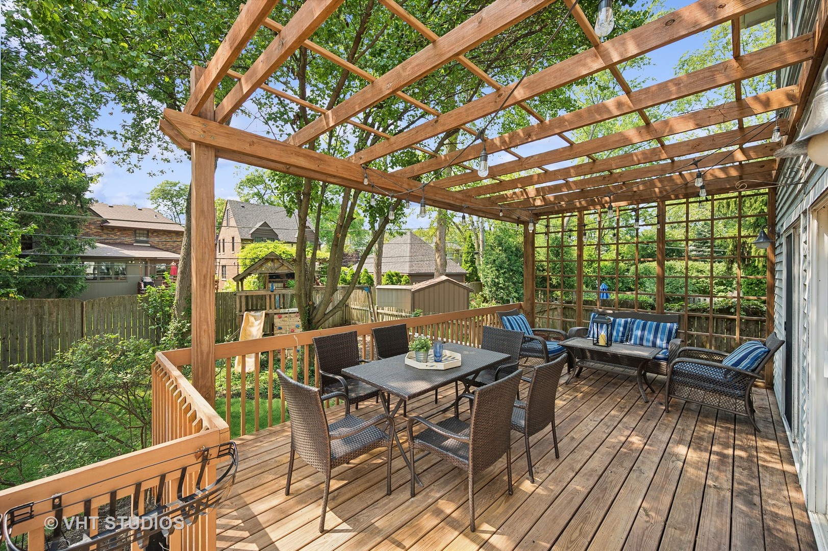 724 Juniper Road Glenview, IL 60025 - Photo 21 of 27 a view of a patio with lawn chairs and wooden floor