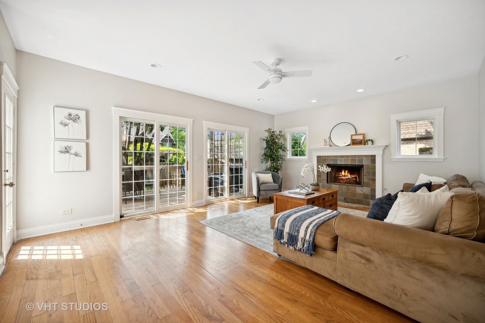 724 Juniper Road Glenview, IL 60025 - Photo 8 of 27 a living room with fireplace furniture and a large window