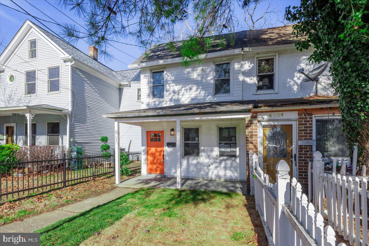 4702 Meade Street Northeast Washington, DC 20019 - Photo 2 of 28 a front view of a house with a porch