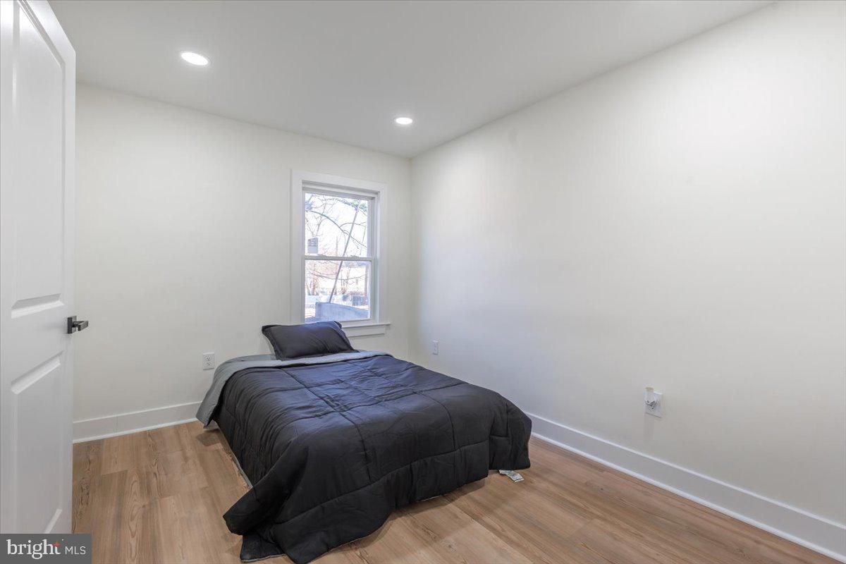4702 Meade Street Northeast Washington, DC 20019 - Photo 21 of 28 a bedroom with a bed and a window