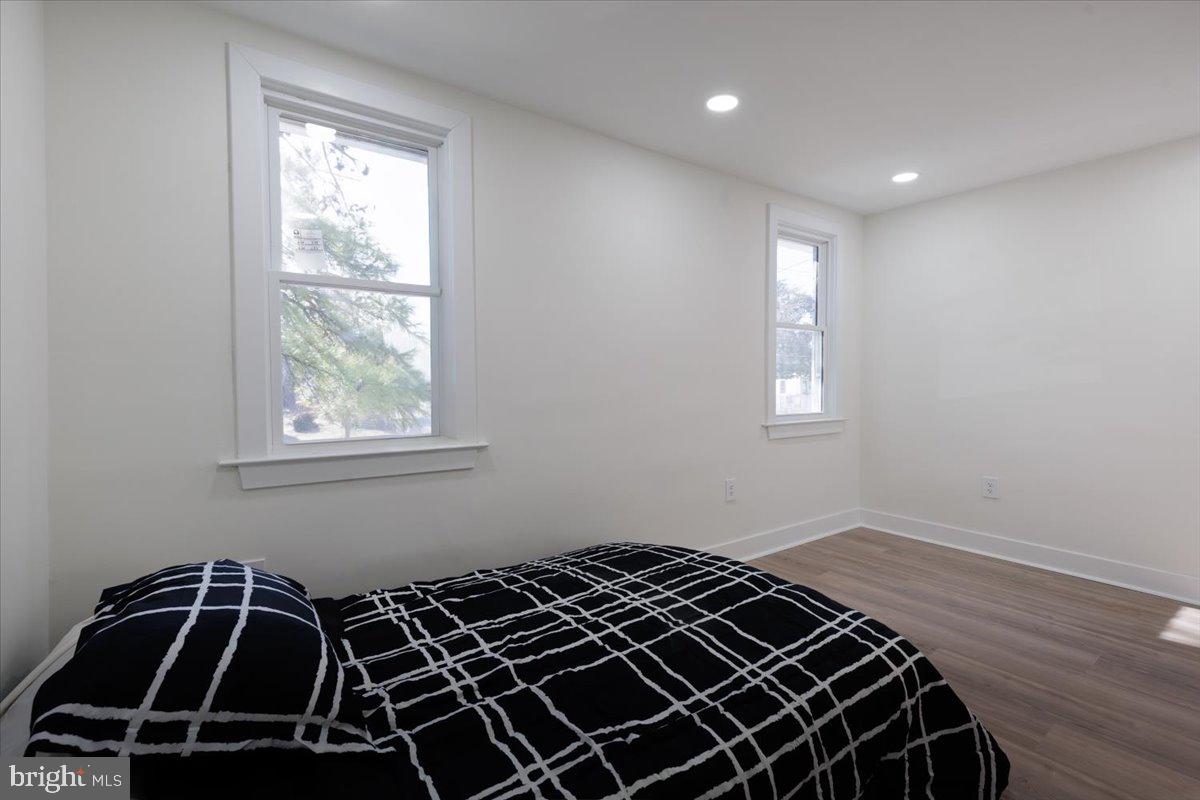 4702 Meade Street Northeast Washington, DC 20019 - Photo 25 of 28 a view of a livingroom with wooden floor and windows