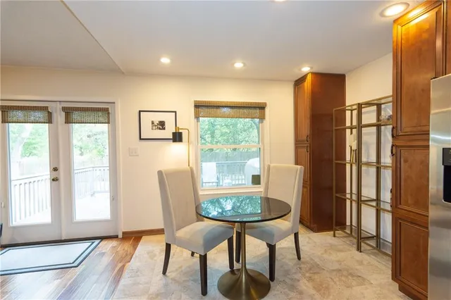 a view of a livingroom with furniture and a window