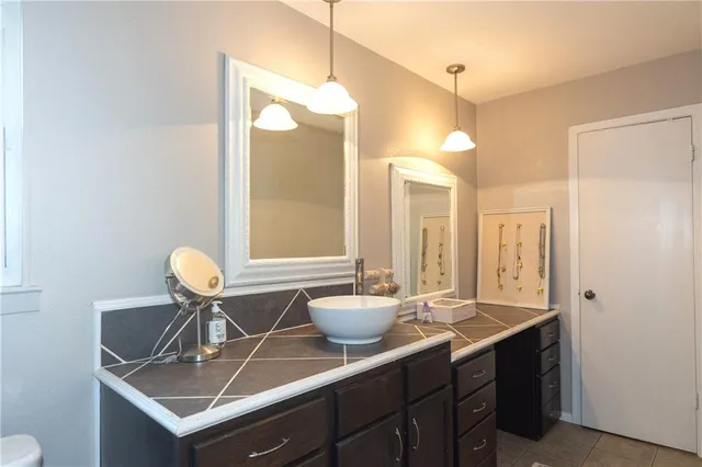 a bathroom with a bathtub and a sink