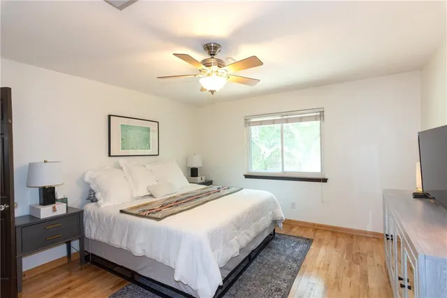a bathroom with a sink vanity granite and a mirror