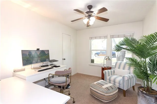a bathroom with a granite countertop sink mirror and a shower