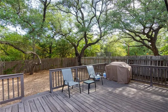 a view of balcony with wooden floor and outdoor seating