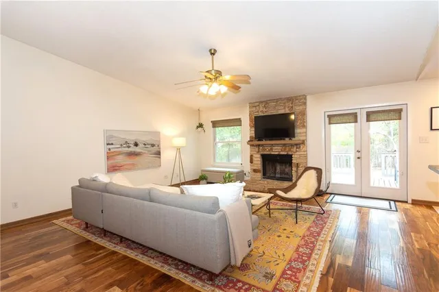 a living room with furniture fireplace and flat screen tv
