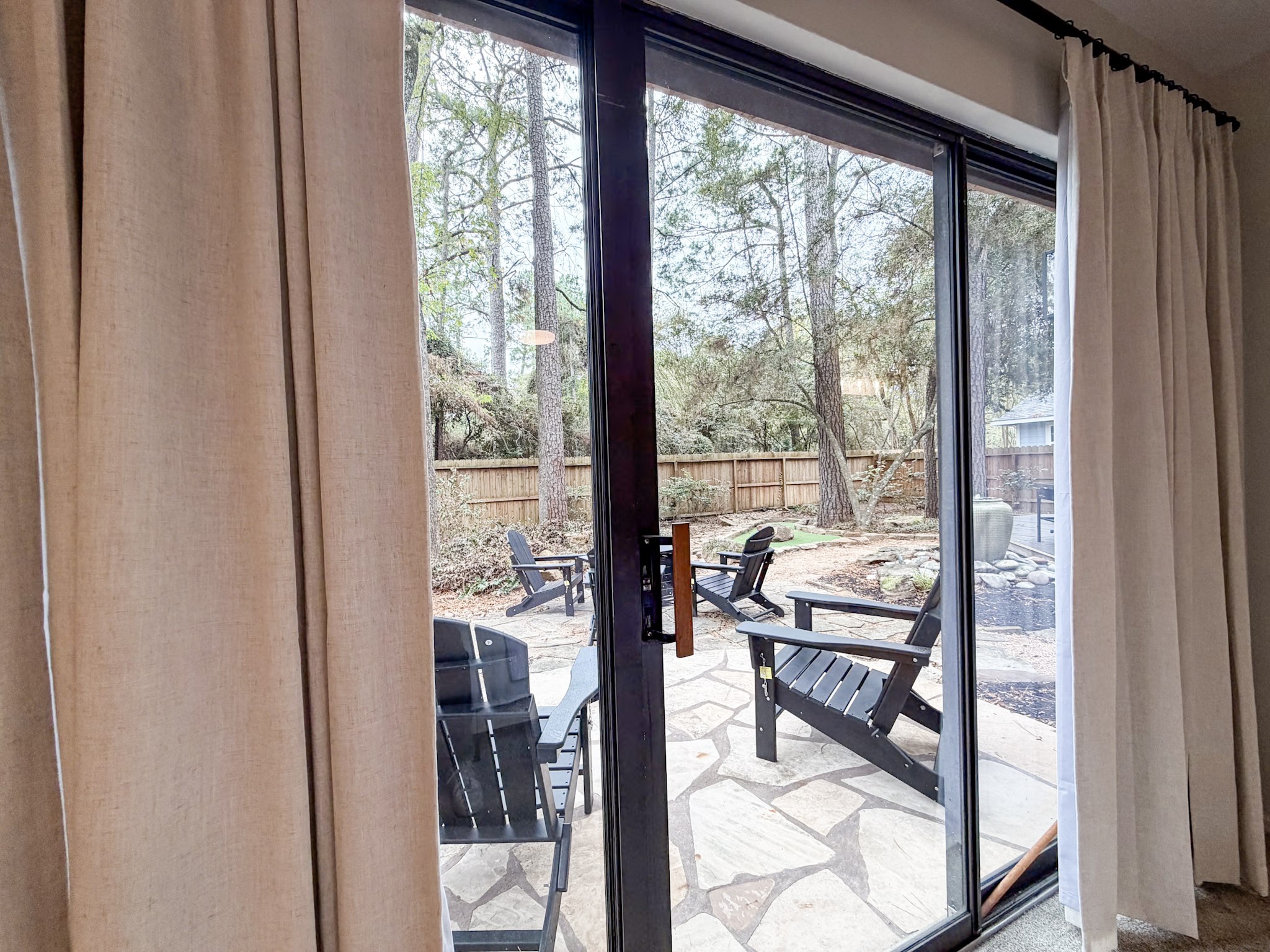 29 Pinewood Forest Court Spring, TX 77381 - Photo 12 of 48 a view of a room with a furniture and floor to ceiling window