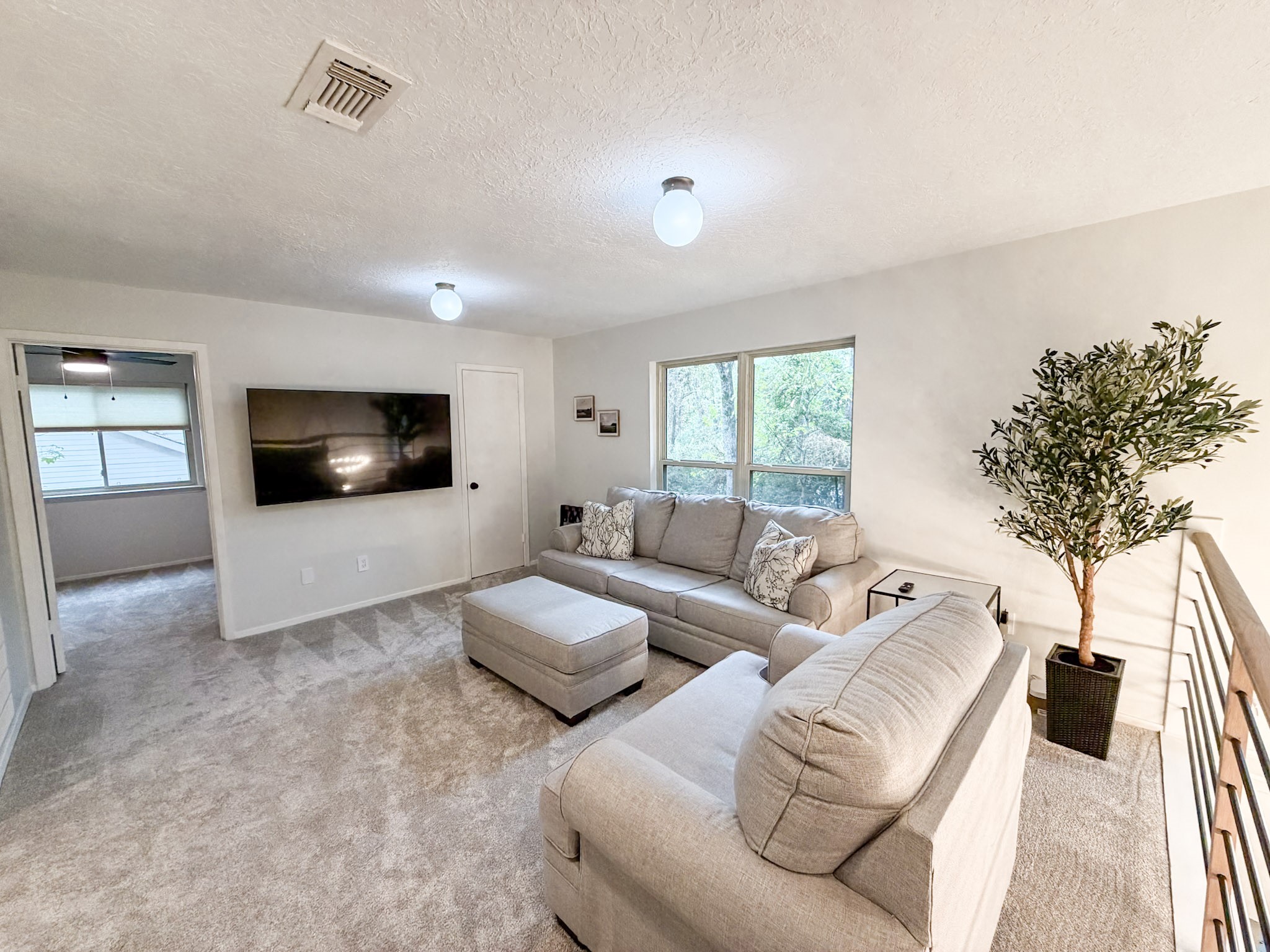 29 Pinewood Forest Court Spring, TX 77381 - Photo 23 of 48 a living room with furniture and a flat screen tv