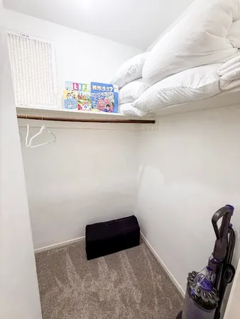 a bathroom with a sink vanity mirror and toilet