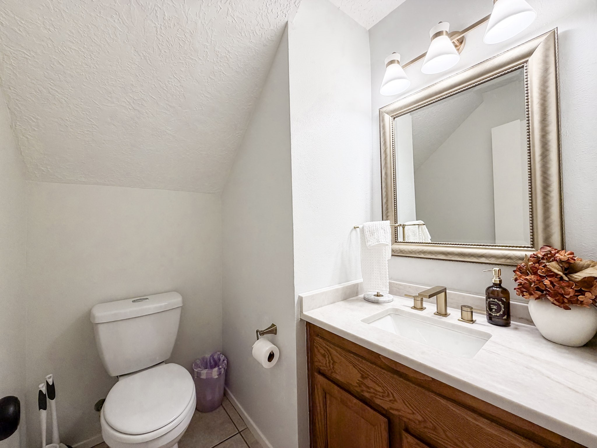 29 Pinewood Forest Court Spring, TX 77381 - Photo 32 of 48 a bathroom with a sink vanity mirror and toilet