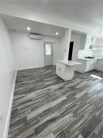 a kitchen with cabinets a sink and appliances