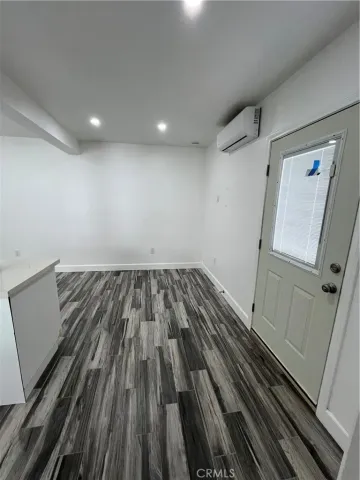 a bathroom with a double vanity sink toilet and mirror