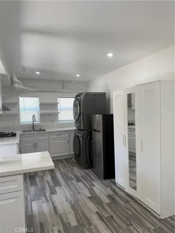 a kitchen with stainless steel appliances a refrigerator and a sink