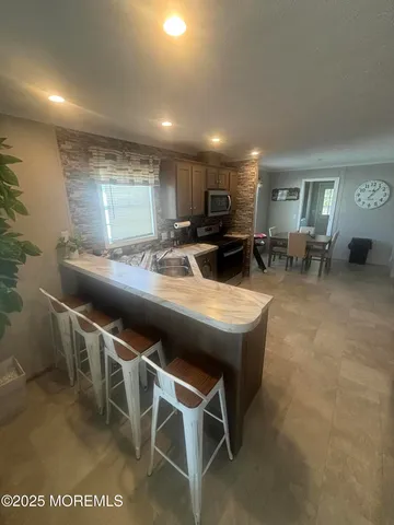 a kitchen with a table and chairs in it