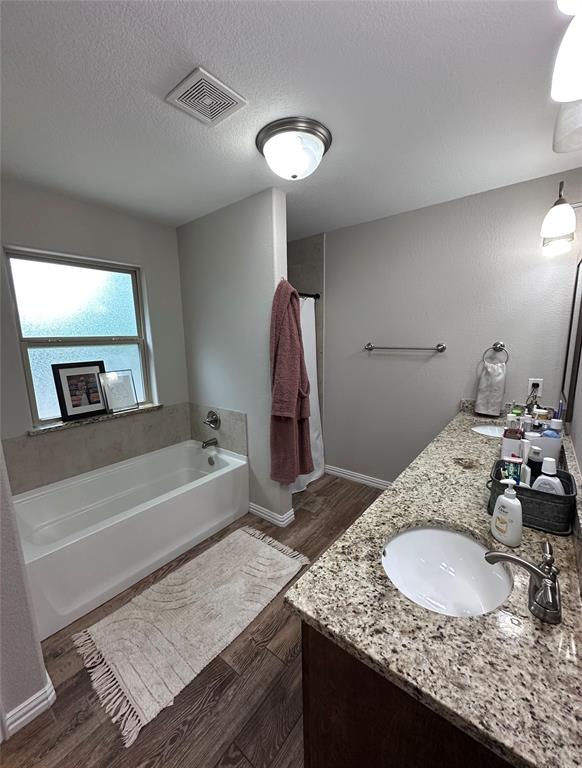1212 Bowman Ridge Road Stephenville, TX 76401 - Photo 23 of 23 a bathroom with a granite countertop sink and a mirror