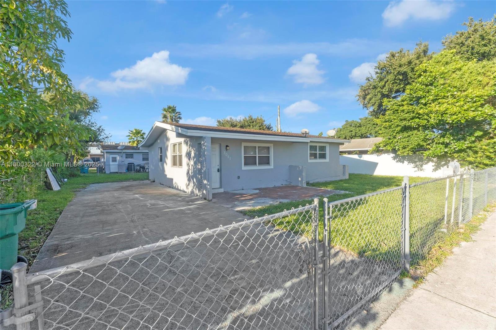 3051 Northwest 77th Street Miami, FL 33147 - Photo 15 of 44 a view of a house with a yard