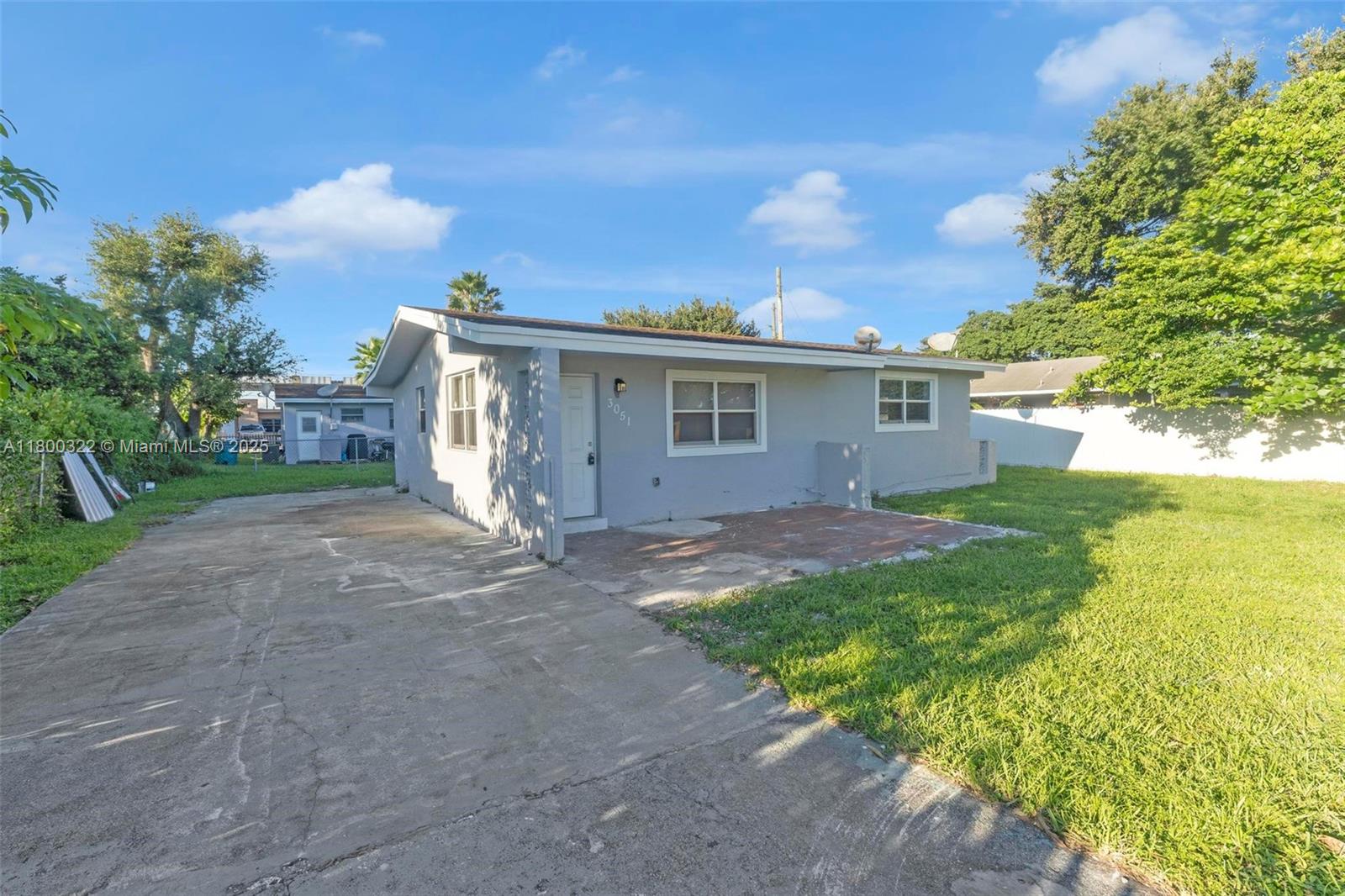 3051 Northwest 77th Street Miami, FL 33147 - Photo 2 of 44 a view of a house with backyard and garden