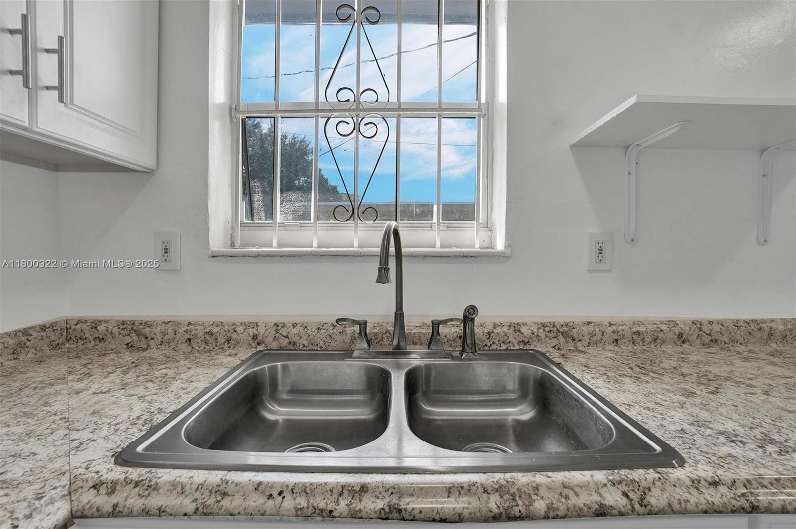3051 Northwest 77th Street Miami, FL 33147 - Photo 28 of 44 a kitchen sink with a granite countertop sink