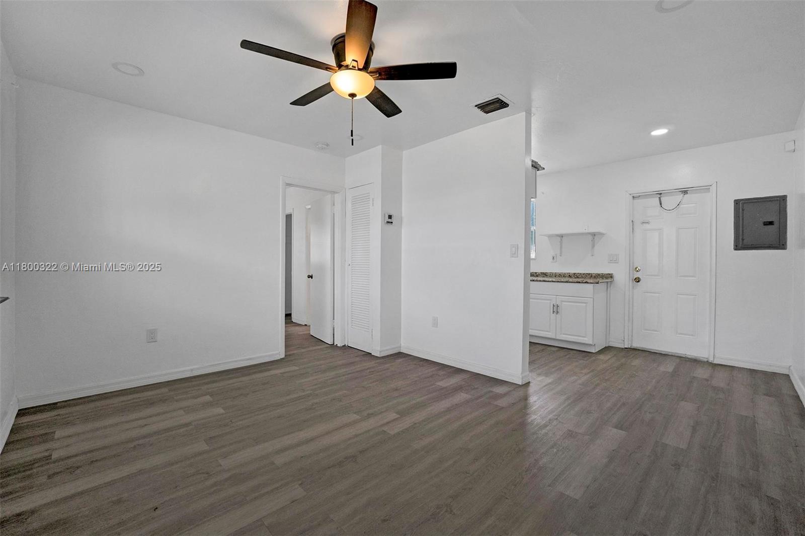 3051 Northwest 77th Street Miami, FL 33147 - Photo 32 of 44 a view of a kitchen with a sink and a refrigerator