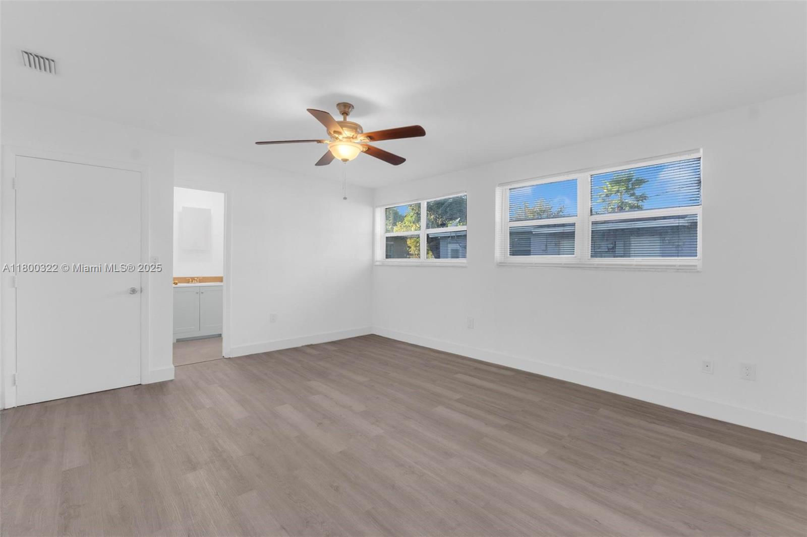 3051 Northwest 77th Street Miami, FL 33147 - Photo 39 of 44 a view of an empty room with a window