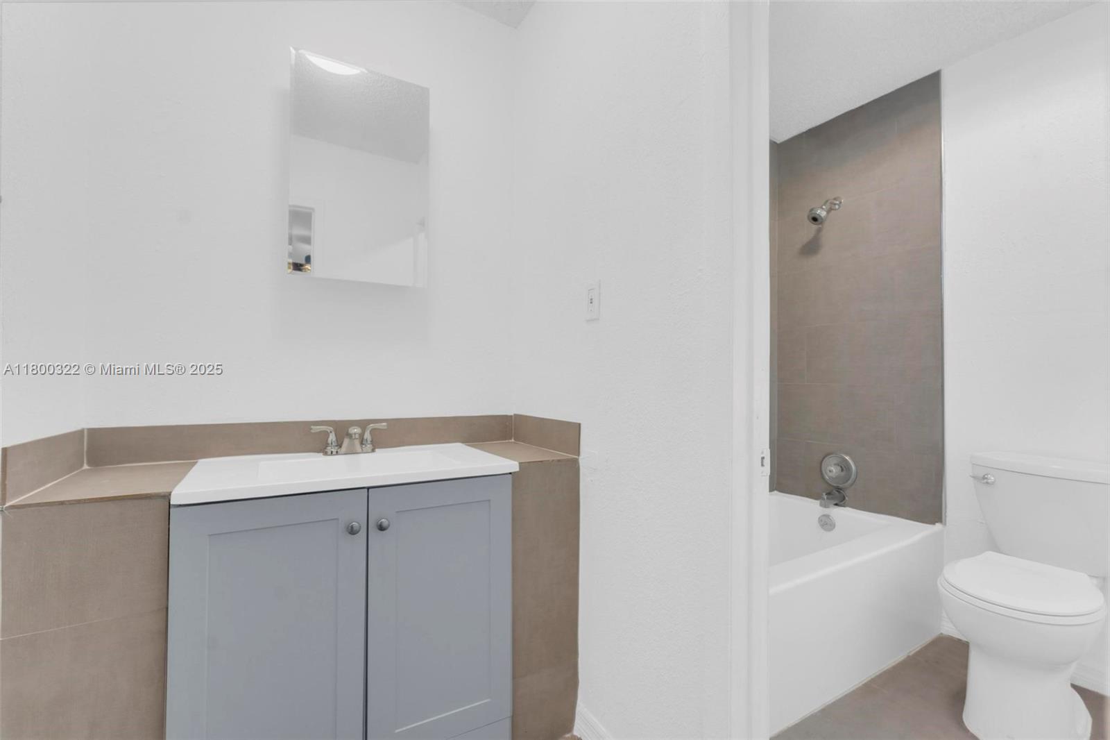 3051 Northwest 77th Street Miami, FL 33147 - Photo 40 of 44 a view of bathroom with a sink toilet and bathtub