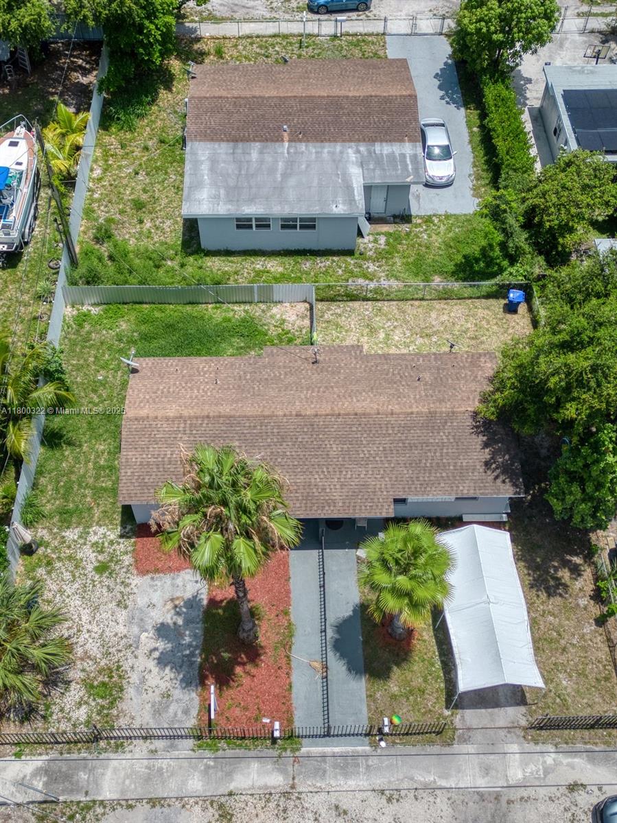 3051 Northwest 77th Street Miami, FL 33147 - Photo 4 of 44 front view of a house with a yard