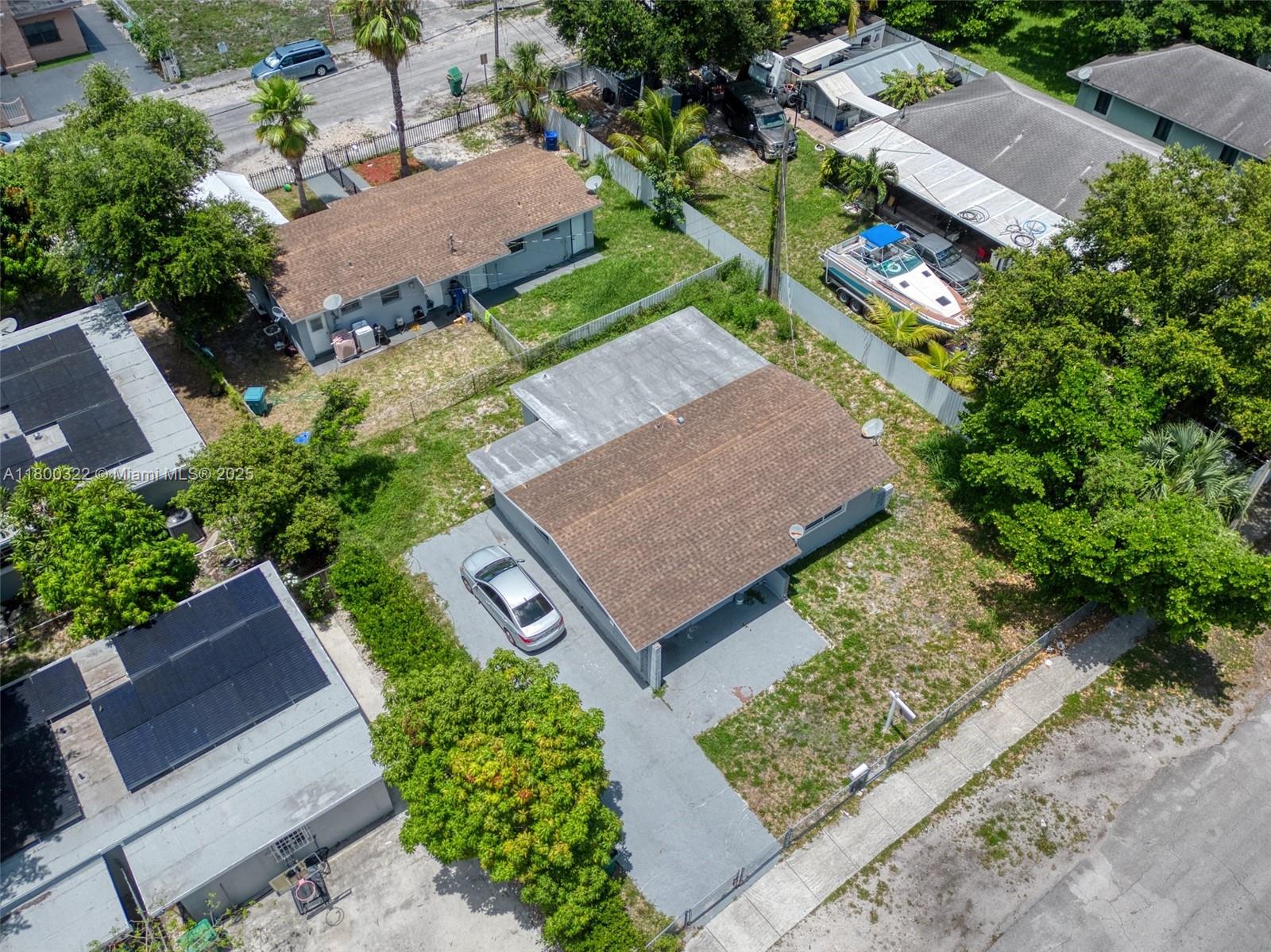 3051 Northwest 77th Street Miami, FL 33147 - Photo 8 of 44 an aerial view of a house with garden space and street view