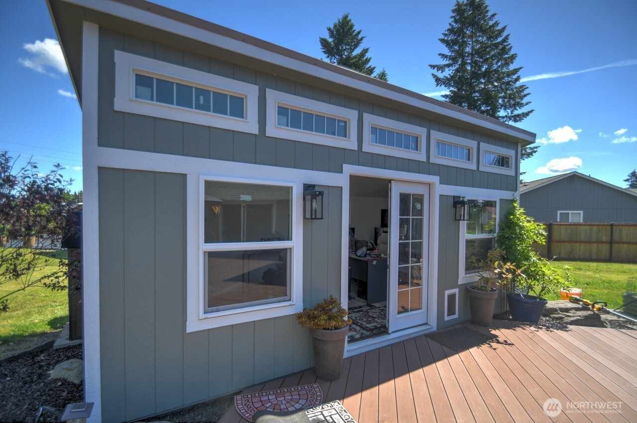 5922 184th Lane Southwest Rochester, WA 98579 - Photo 18 of 34 a view of house with backyard outdoor seating and green space